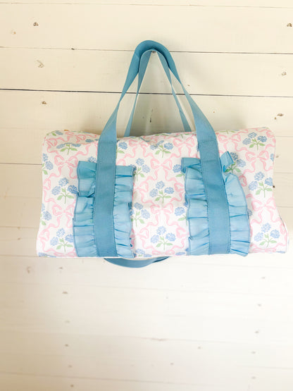 Blue Floral Ruffle Duffle
